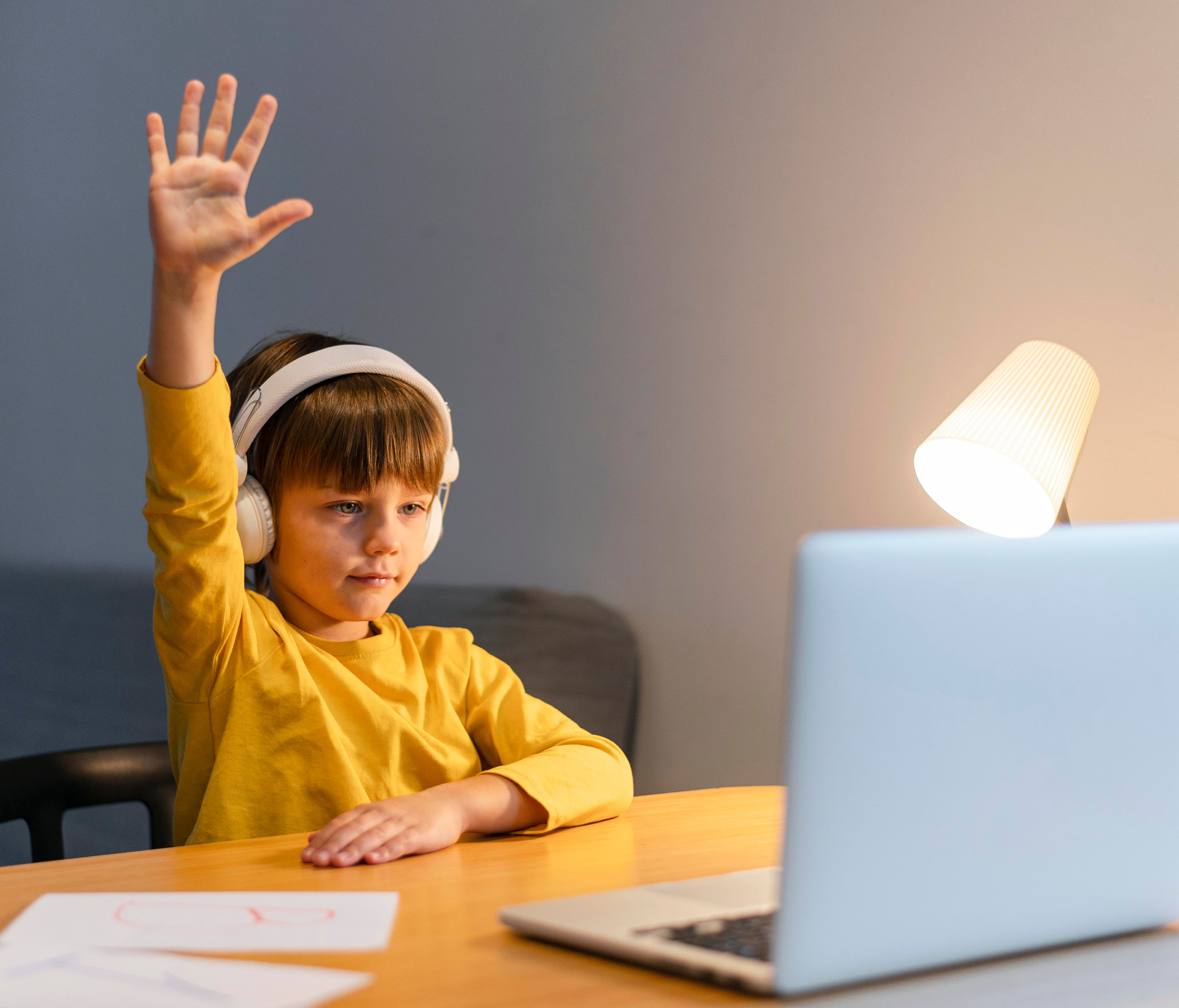 A young student learning to code on a laptop
